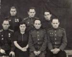 Комсорг 21-го гвардійського окремого інженерно-саперного батальону М.А. Ємельянов в колі працівників політвідділу 35-ї інженерно-саперної бригади I- го Білоруського фронту. (Другий ряд, перший зліва. Грудень 1944 р.).